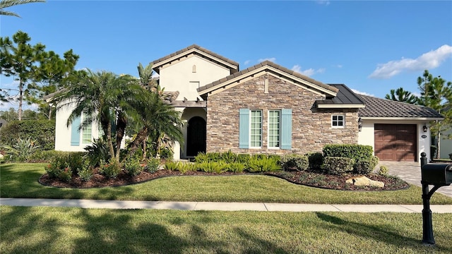 mediterranean / spanish-style house with a front lawn and a garage