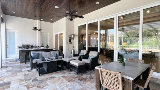 view of patio / terrace with an outdoor living space and ceiling fan