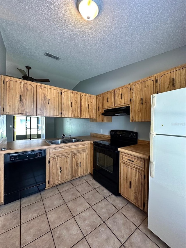 kitchen with light tile floors, ceiling fan, a textured ceiling, black appliances, and sink