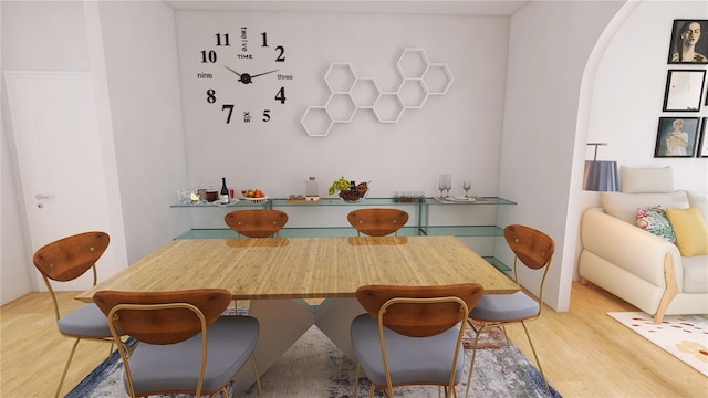 dining space featuring light wood-type flooring