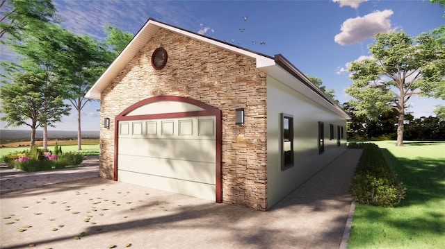 garage featuring a yard