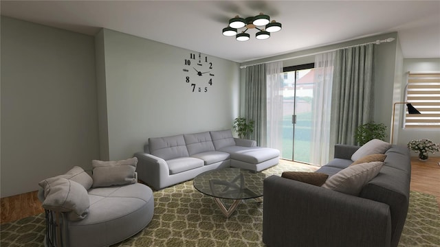 living room with a chandelier, a wealth of natural light, and hardwood / wood-style flooring