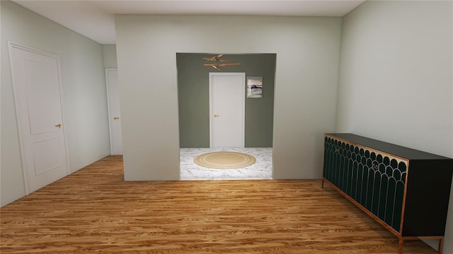 empty room with light hardwood / wood-style flooring