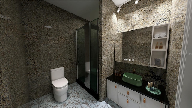 bathroom featuring toilet, a shower with door, large vanity, and tile flooring