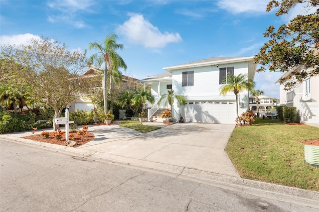 view of front facade featuring a front yard and a garage