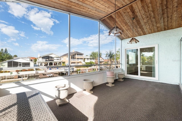 sunroom / solarium with lofted ceiling and wood ceiling