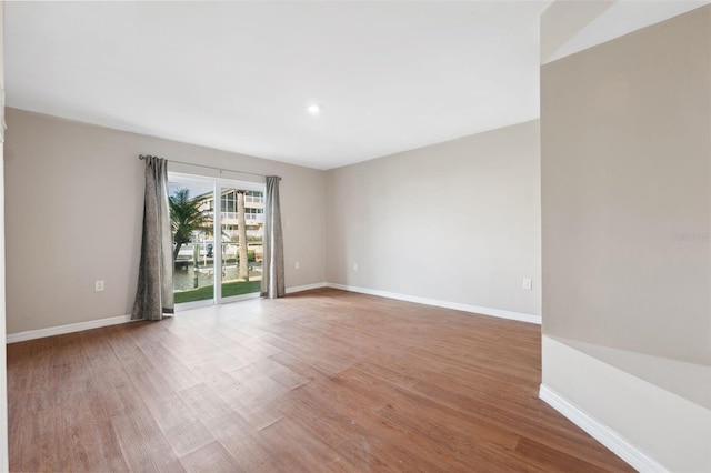 spare room with light hardwood / wood-style floors