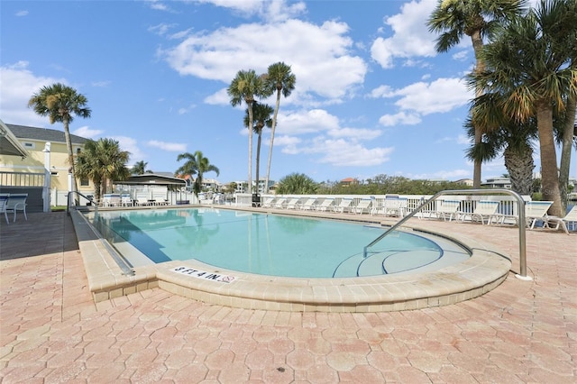 view of swimming pool with a patio