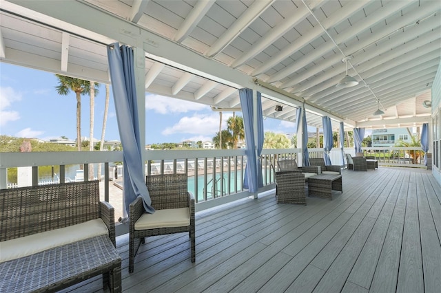 wooden deck with an outdoor living space