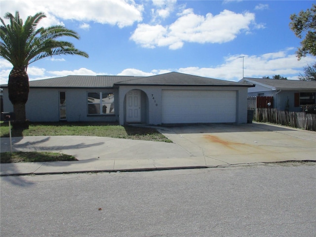 ranch-style home with a garage