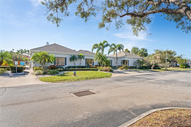 ranch-style home with a front yard