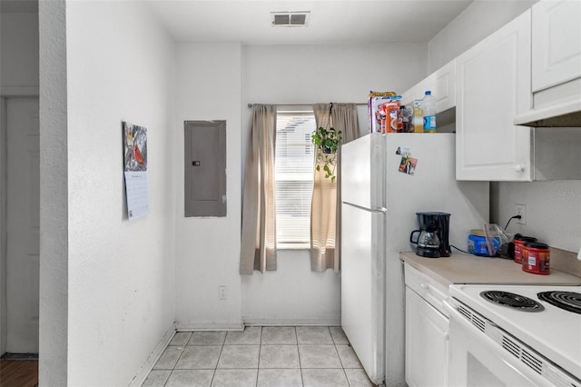 kitchen featuring light tile patterned flooring, white cabinetry, white range with electric stovetop, and electric panel