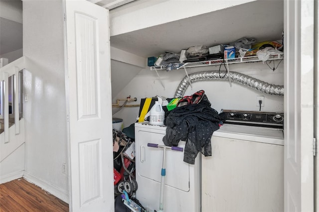 clothes washing area featuring wood-type flooring and independent washer and dryer