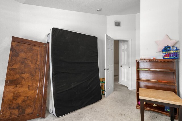 interior space with a textured ceiling