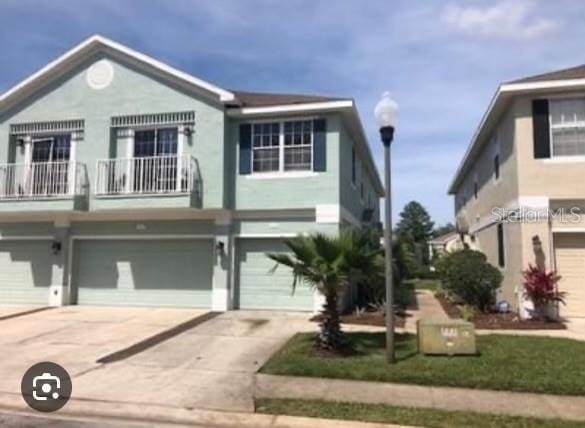 view of front of house featuring a balcony