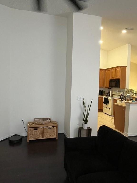 kitchen with light hardwood / wood-style floors and white range