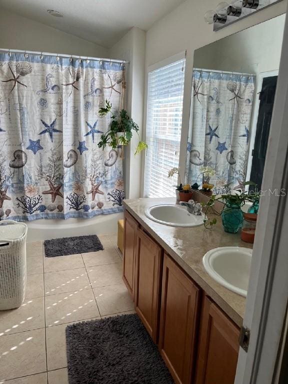 bathroom featuring tile patterned flooring, vanity, lofted ceiling, and shower / tub combo