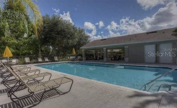 view of pool featuring a patio