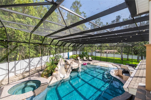 view of pool with an in ground hot tub, a patio, and a lanai