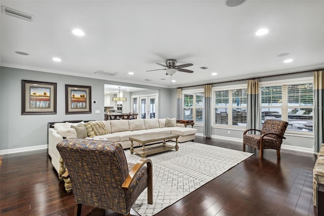 living room with french doors, dark wood-type flooring, ceiling fan, and ornamental molding