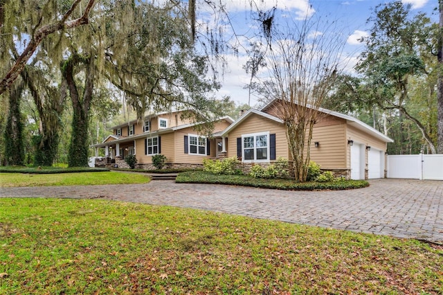 ranch-style home with a front yard and a garage