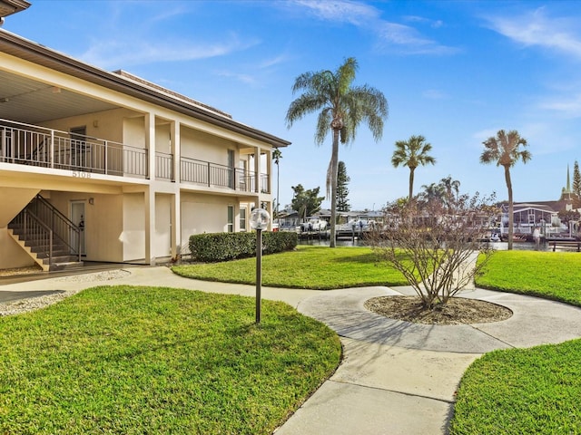 view of home's community with a lawn