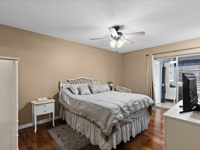 5108 Amulet Dr Unit 206, New Port Richey, FL 34652 - bedroom featuring a textured ceiling, dark hardwood / wood-style flooring, and ceiling fan