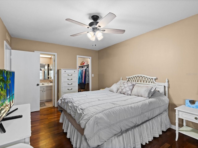 5108 Amulet Dr Unit 206, New Port Richey, FL 34652 - bedroom featuring a walk in closet, ensuite bath, ceiling fan, dark wood-type flooring, and a closet