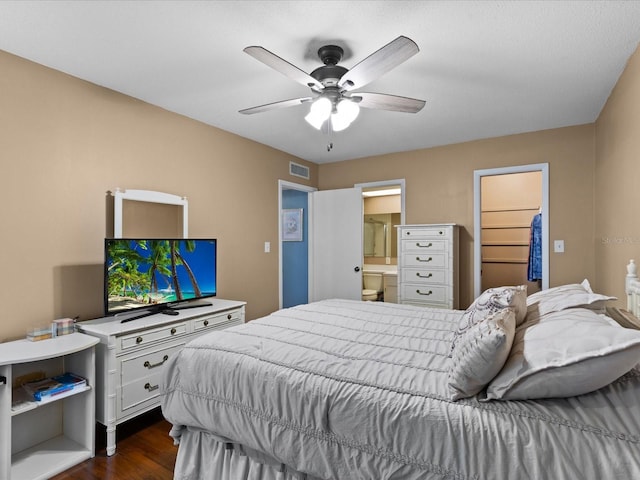 5108 Amulet Dr Unit 206, New Port Richey, FL 34652 - bedroom featuring ceiling fan, a spacious closet, connected bathroom, dark hardwood / wood-style floors, and a closet