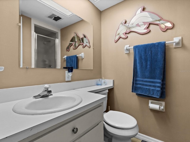 5108 Amulet Dr Unit 206, New Port Richey, FL 34652 - bathroom with vanity, a shower with shower door, and toilet