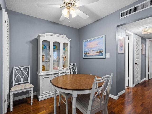 5108 Amulet Dr Unit 206, New Port Richey, FL 34652 - dining space featuring ceiling fan, dark hardwood / wood-style flooring, and a textured ceiling