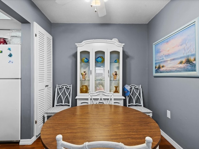 5108 Amulet Dr Unit 206, New Port Richey, FL 34652 - dining room featuring hardwood / wood-style floors, a textured ceiling, and ceiling fan