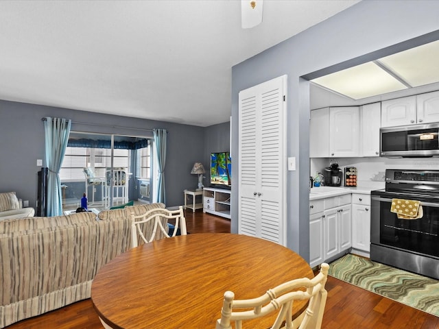 5108 Amulet Dr Unit 206, New Port Richey, FL 34652 - dining space featuring ceiling fan and dark wood-type flooring