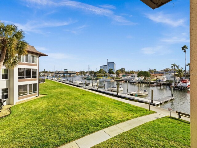 5108 Amulet Dr Unit 206, New Port Richey, FL 34652 - view of dock featuring a lawn and a water view