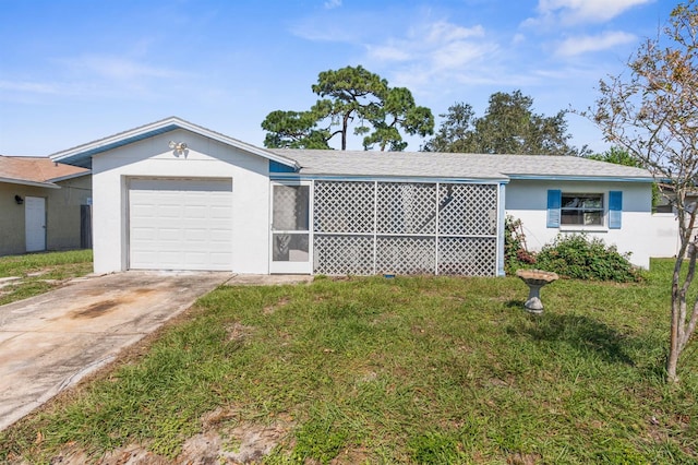 ranch-style house with a garage and a front lawn