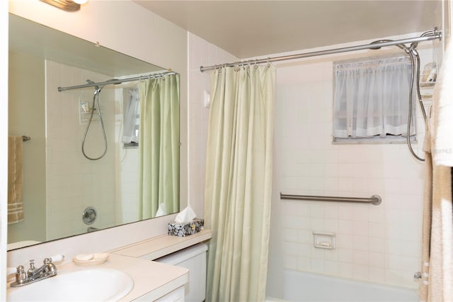 bathroom with shower / bath combo with shower curtain and vanity