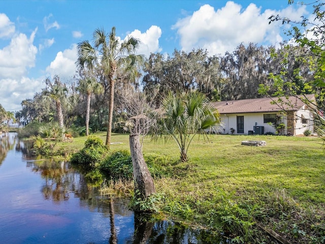 property view of water with a fire pit