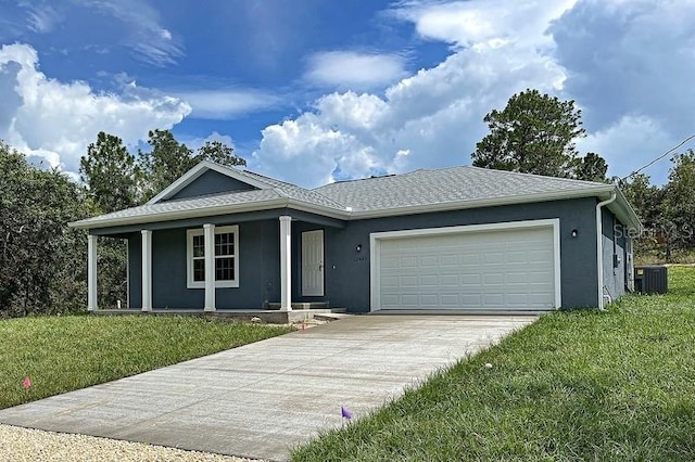 ranch-style house featuring a front lawn, covered porch, a garage, and central AC unit