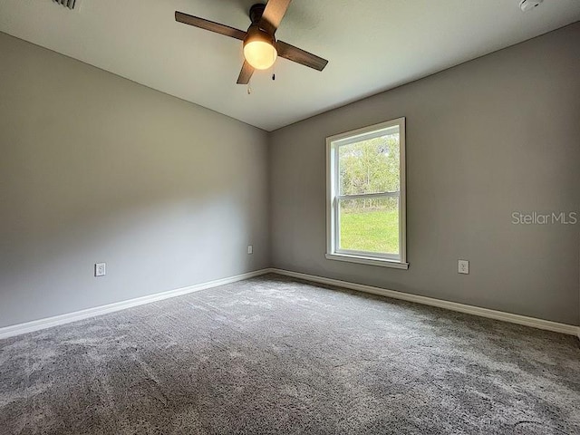 unfurnished room with carpet floors and ceiling fan