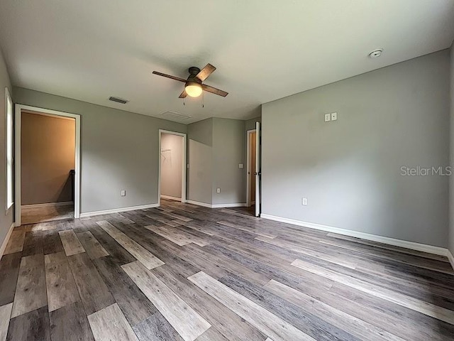 unfurnished bedroom with hardwood / wood-style flooring and ceiling fan