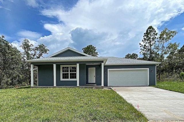 view of front facade with a garage and a front yard