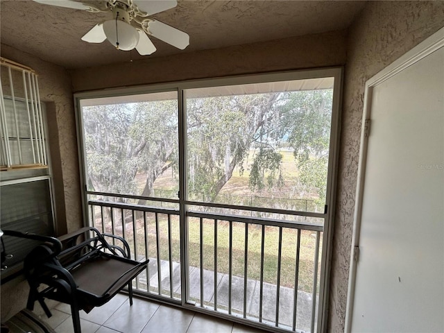 sunroom with ceiling fan and a wealth of natural light