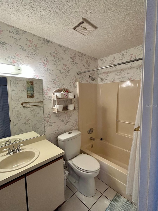 full bathroom featuring shower / bath combination with curtain, vanity, tile flooring, toilet, and a textured ceiling