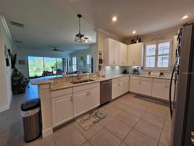 kitchen featuring kitchen peninsula, stainless steel dishwasher, crown molding, white cabinets, and hanging light fixtures