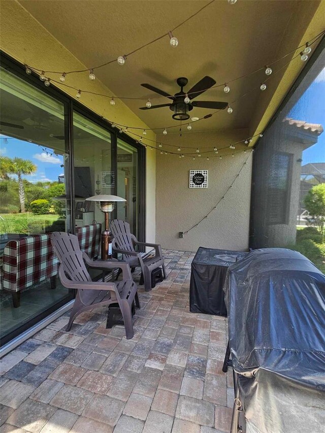 view of patio with grilling area and ceiling fan