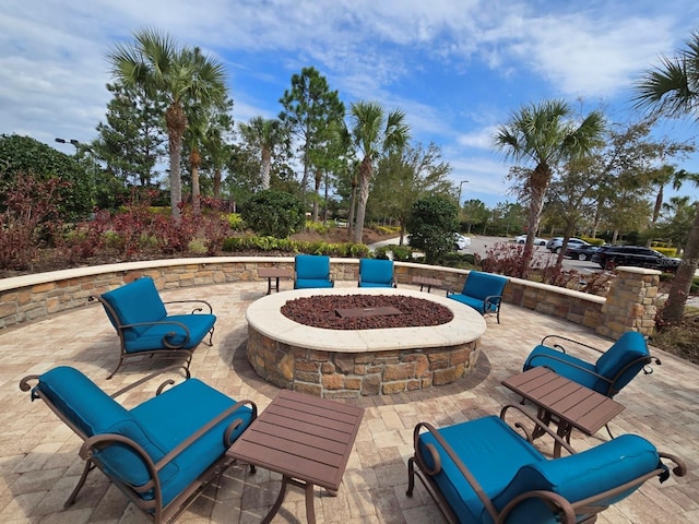 view of patio / terrace featuring an outdoor fire pit