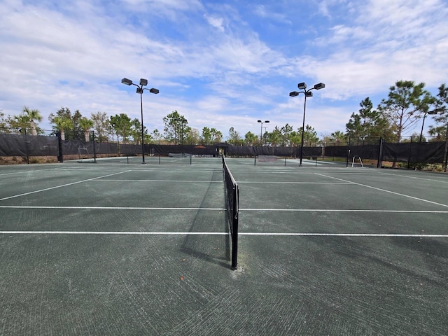 view of sport court with fence