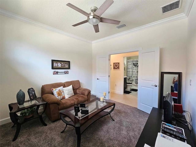 living area with carpet flooring, visible vents, and ornamental molding