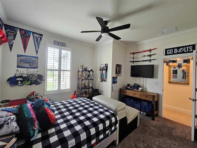 carpeted bedroom featuring baseboards, a textured ceiling, ceiling fan, and ornamental molding