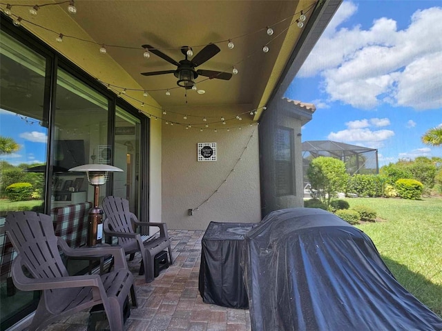 view of patio / terrace featuring a grill and ceiling fan